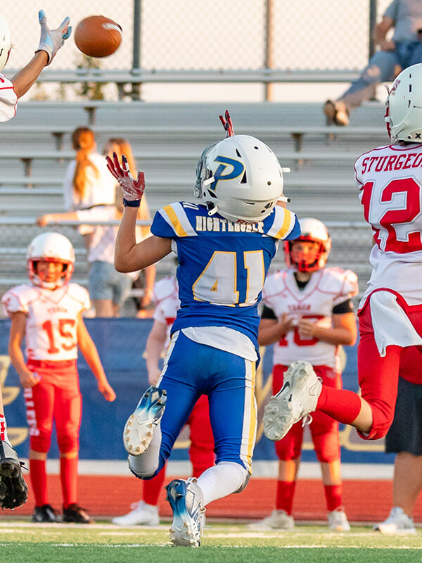 A Piedmont Youth football player watching the ball. 